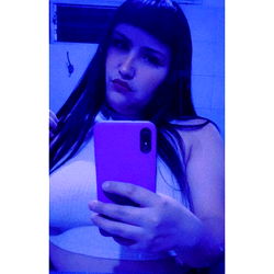 Sassy Woman Taking a Selfie in Bathroom Mirror