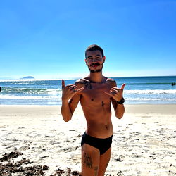 Fitness enthusiast posing on the beach