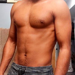 Toned Male Model Showcasing Abs in Fitness-themed Photo