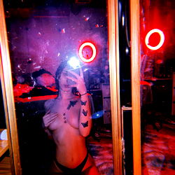 Dae, a scandalous model posing in a mirror