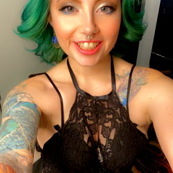 AnnabelletheEntertainer - Striking Female Model with Tattoos and Unique Style