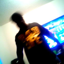 A Man in a Black Shirt Standing Inside