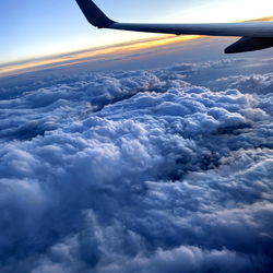 Airplane Soaring Above Cloudy Skies