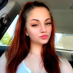 Jessica, a Chicago-based model posing in a car