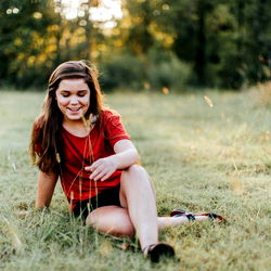 Aubrey in a Red Shirt in the Grass