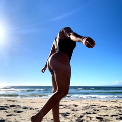 Fitness enthusiast enjoys beach workout