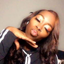 Model Monique showcasing a glamorous pose with her hand on her hip