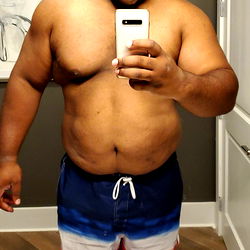 Strong and Muscular Man in Swimsuit Taking Selfie