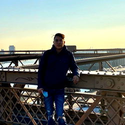 A Man Standing on a Bridge