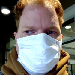 Red-haired man in a mask