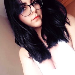 Fashionable Female with Short Hair, Glasses, and Smile, Age 25, Gender Female