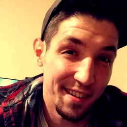 Young Adult Man with Facial Hair, Posing for a Selfie