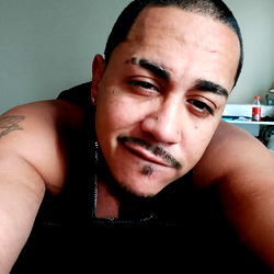 J C, a Man Relaxing in Bed with Sleepy Eyes