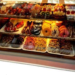 A Display Case of Assorted Pastries and Donuts