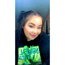 Smiling Woman in Shirt with Tie-Dye Design