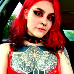 Stylish Gothic Model in a Red Latex Outfit