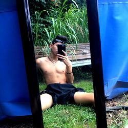 Fashionable Fitness Model Posing for Mirror