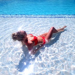 Model Kate Sunbathing in Swimming Pool