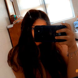 California Model Taking Selfie in Bathroom Mirror with Tags