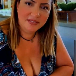 Akravit1 in a casual pose, smiling at the camera