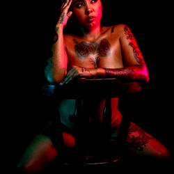 Alejandra Cortez, a Colombian model posing for OnlyFans in a black and white photograph