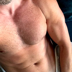 Muscular Man in Fitness Gear, Taking Selfie