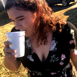 An Onlyfans Model Drinking from a Cup