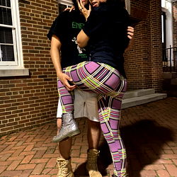 Two Young Adults Embracing Outdoors