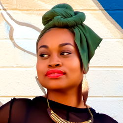 Posing for a portrait with graffiti in the background