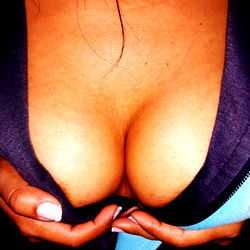 Adult model showcasing her enhanced body