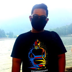 Astina - A Young Adult Man, Standing By The Lake