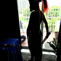 Model Apollo Pose with Spartan Helmet in Balcony