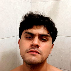 A Shirtless Man in a Bathroom