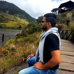 Man Sitting at Waterfront