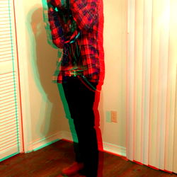 Ahmad, a Marietta native, poses in a room with a distinct perspective.