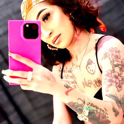 OnlyFans Model Ari.You.Pretty in an Elegant Pose with a Pink Phone