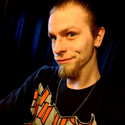 Casual Photograph of a Young Man with Tattoos and a Necklace