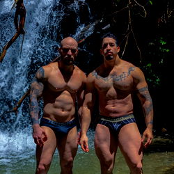 Fit Couple Posing for Onlyfans in a Serene Natural Setting