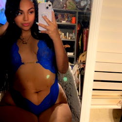 Abby, the OnlyFans Model Posing in a Fiery Blue Bikini and Black Lingerie