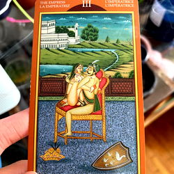 A Tarot Card with a Themed Artwork