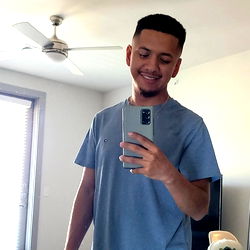 Smiling Young Man Taking a Selfie in His T-Shirt and Jeans