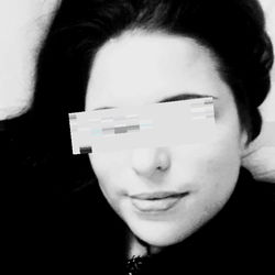 Woman in a Selfie with Blurry Text Overlay