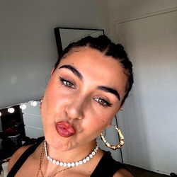 Cristyna_mad on social media with a strong posture