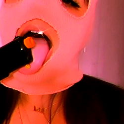 An OnlyFans Model Playfully with Face Mask