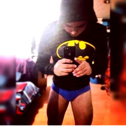 Batman Hoodie Model Taking Selfie with Fit Physique