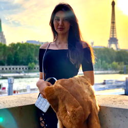 Fashionable model posing against a stunning city backdrop