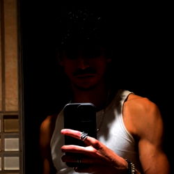 Abn showcasing fitness and style in bathroom mirror selfie