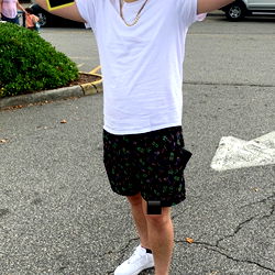 Model RAVEDADDYY in White T-Shirt at Shopping Mall