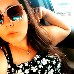 Ali in a Stylish Flower-Print Shirt and Sunglasses