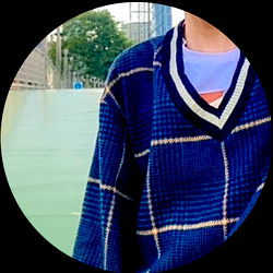 Fashionable Individual in Plaid Jacket